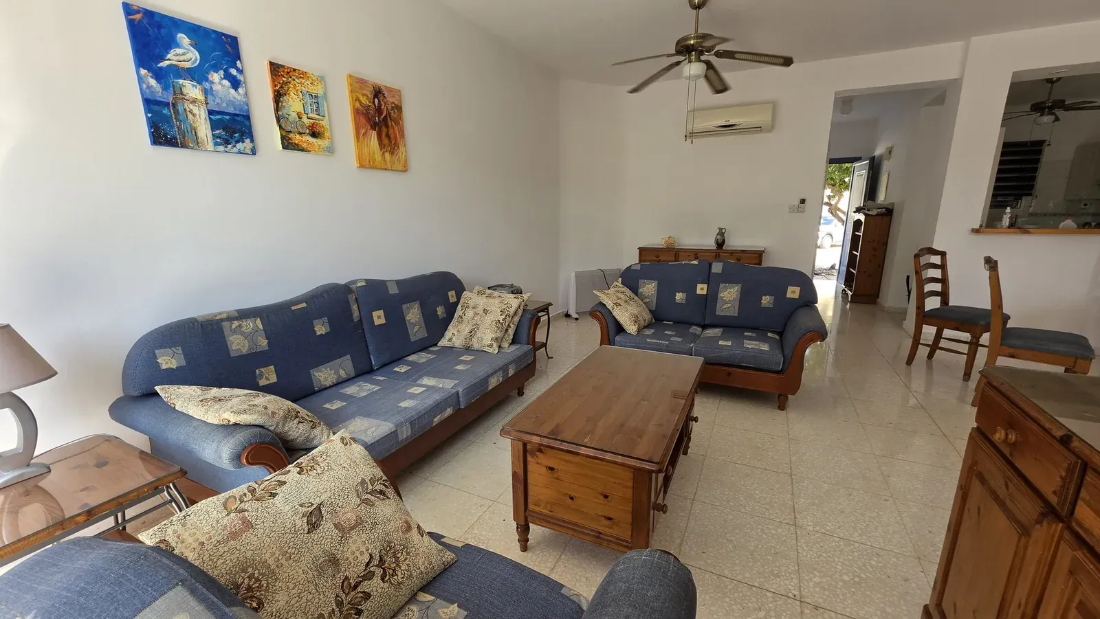 The living room at Villa Nadezda with hand-painted canvases on the walls