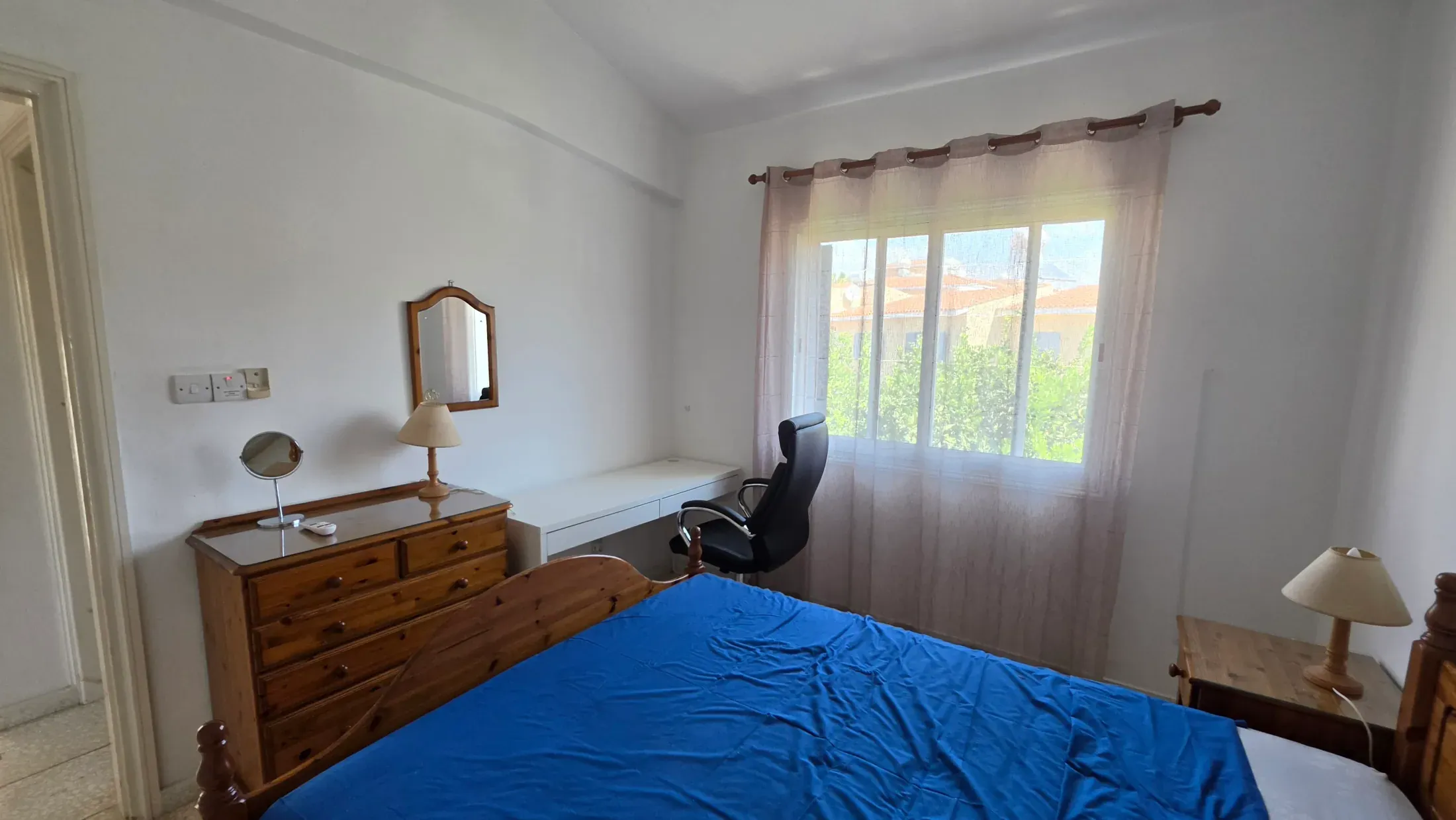 Double bedroom at Villa Nadezda with a desk and a view over the gardens
