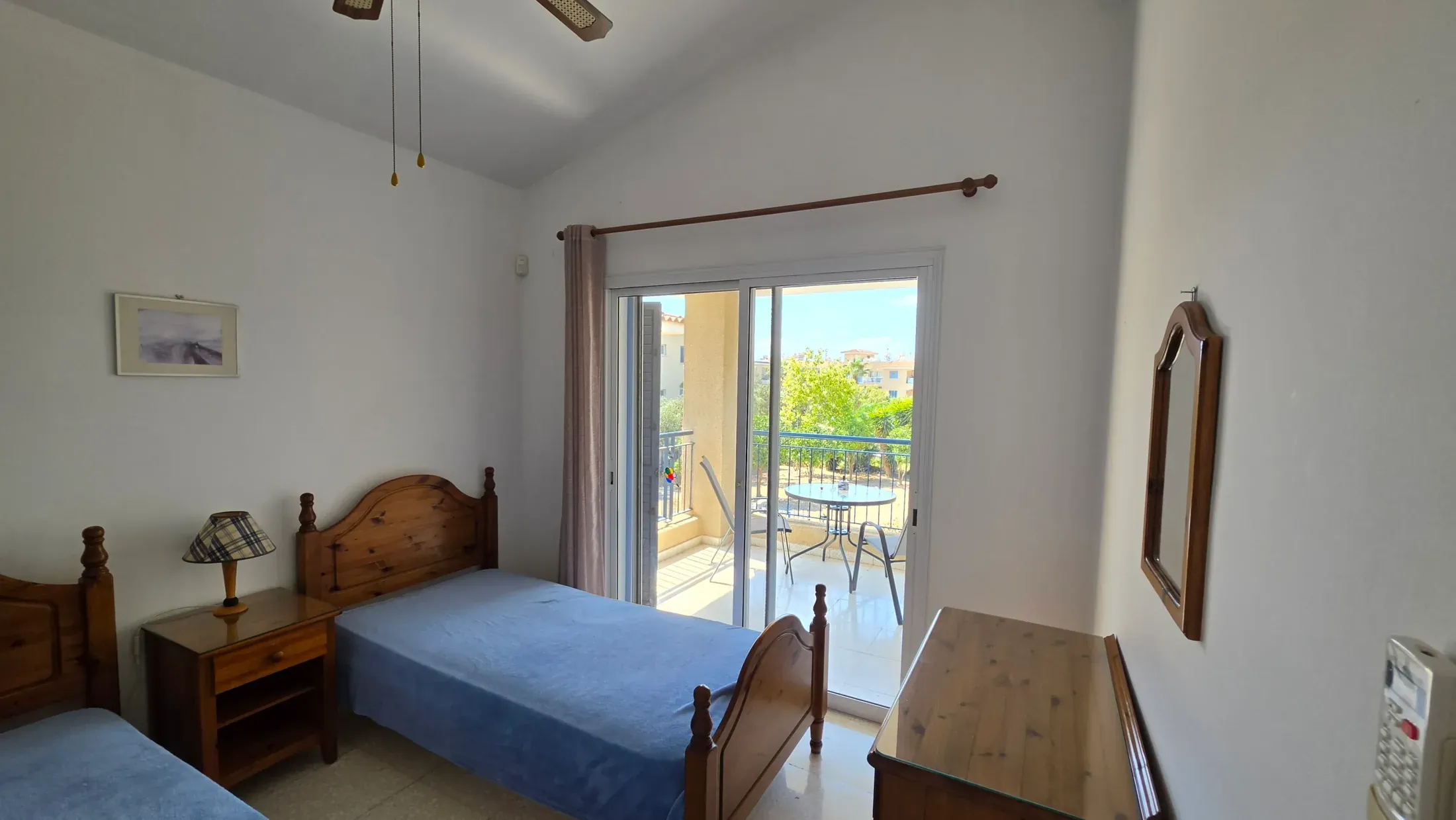 Twin bedroom at Villa Nadezda with its own small balcony over the garden