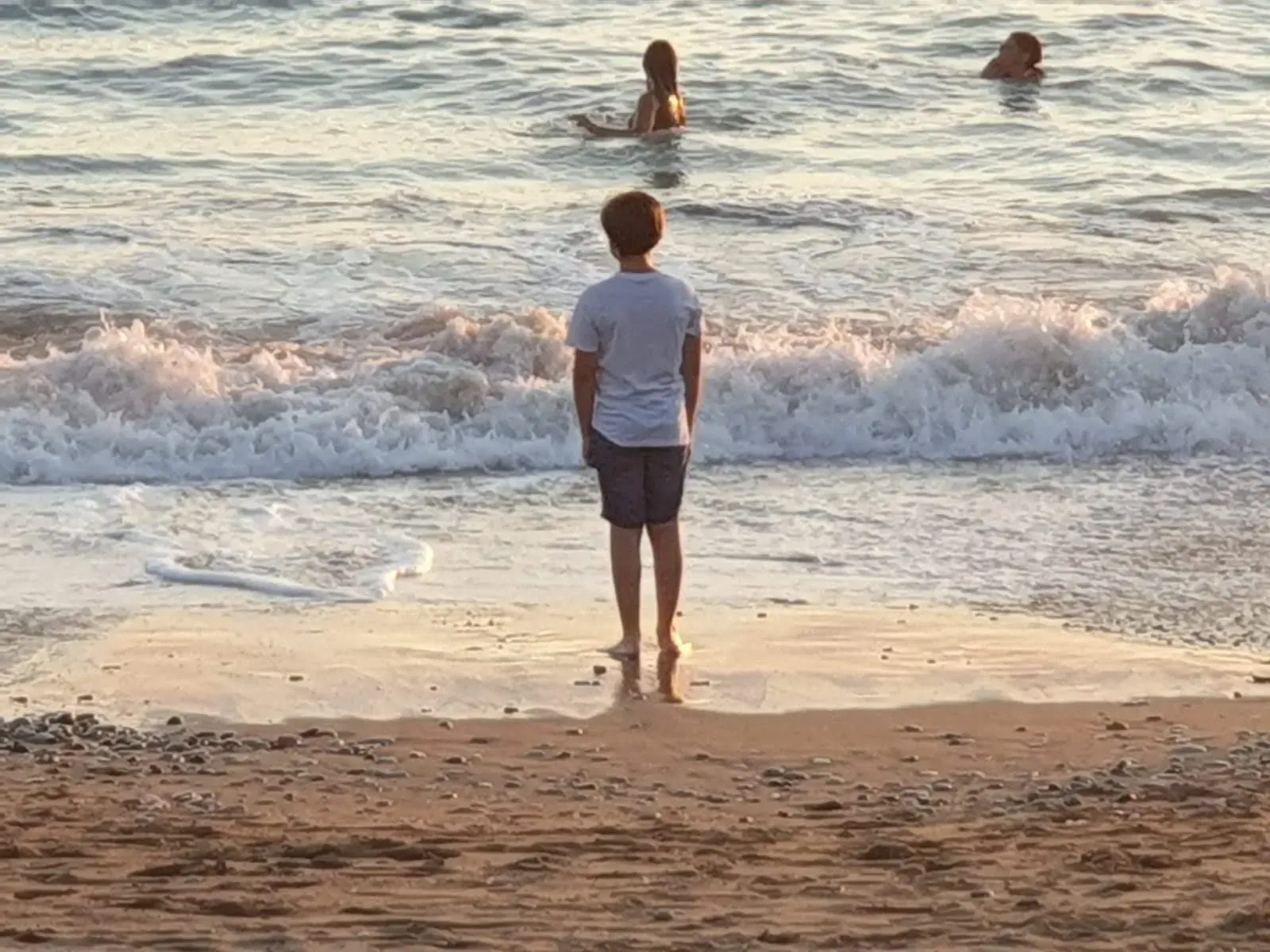 A child on the beach at sunset near Paphos, Cyprus