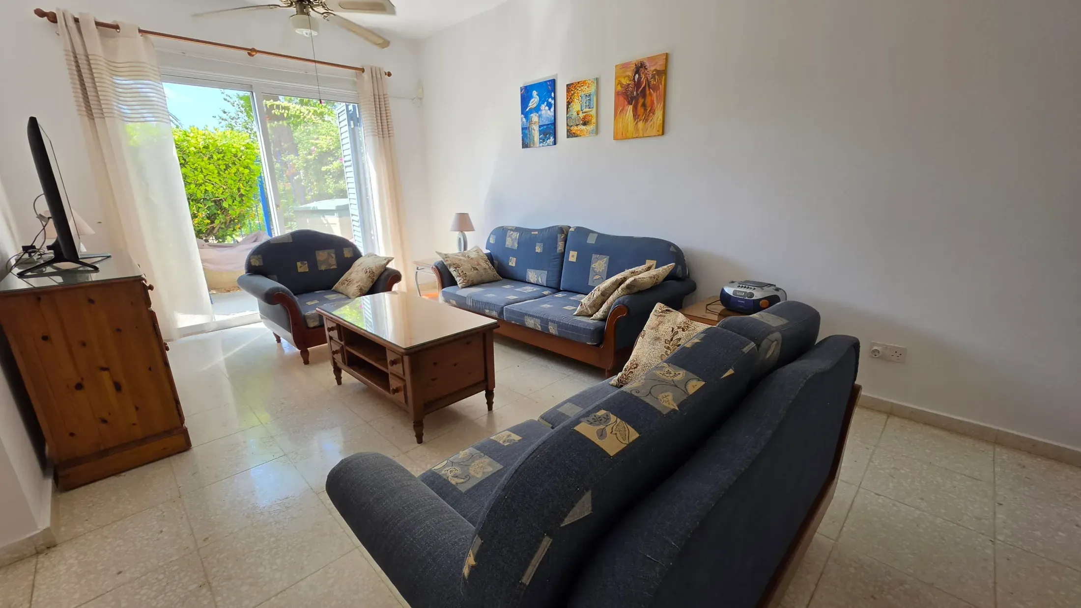 The living room with its two sofas and the doors onto the patio