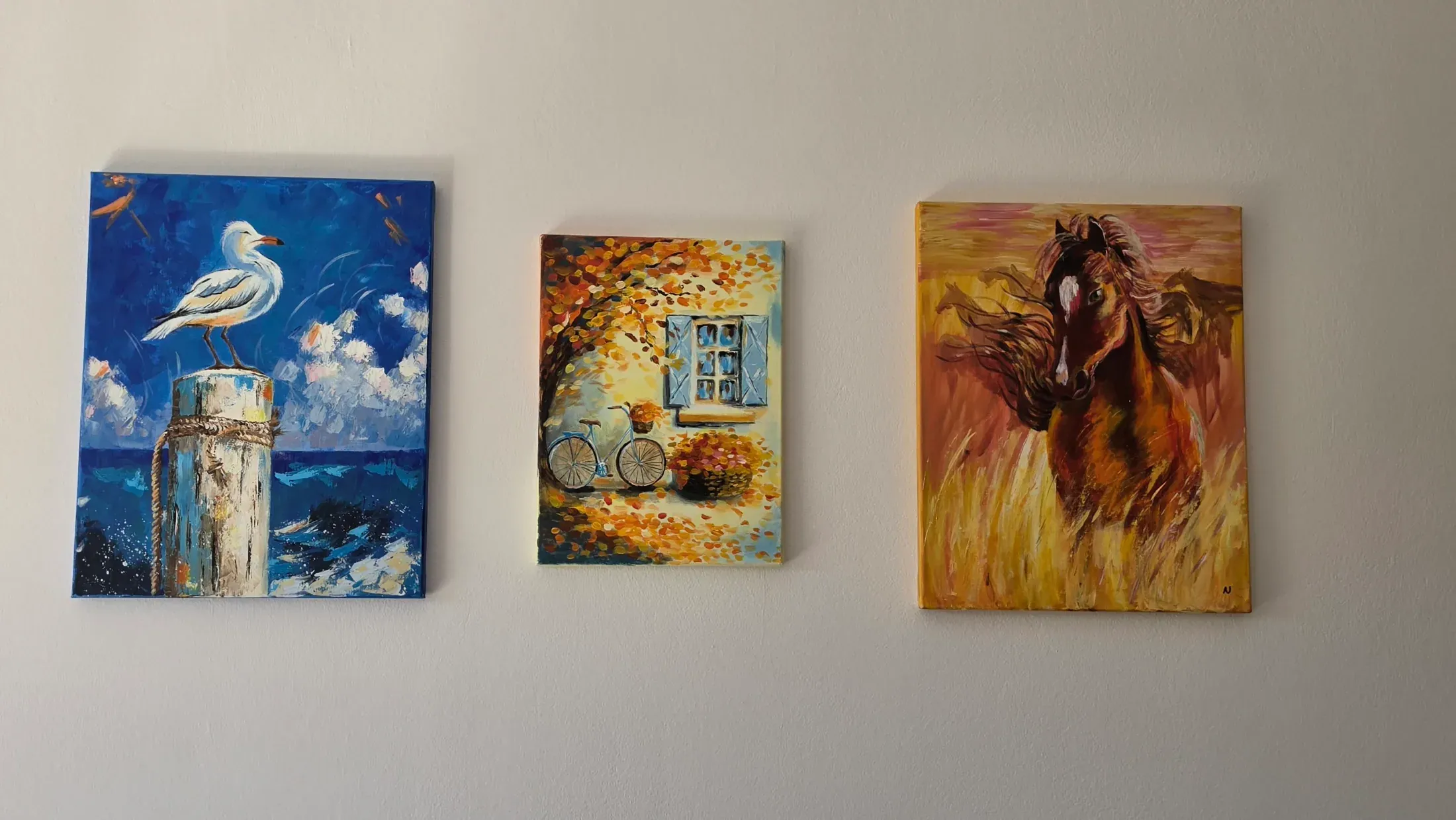 Hand-painted canvases on the living-room wall at Villa Nadezda